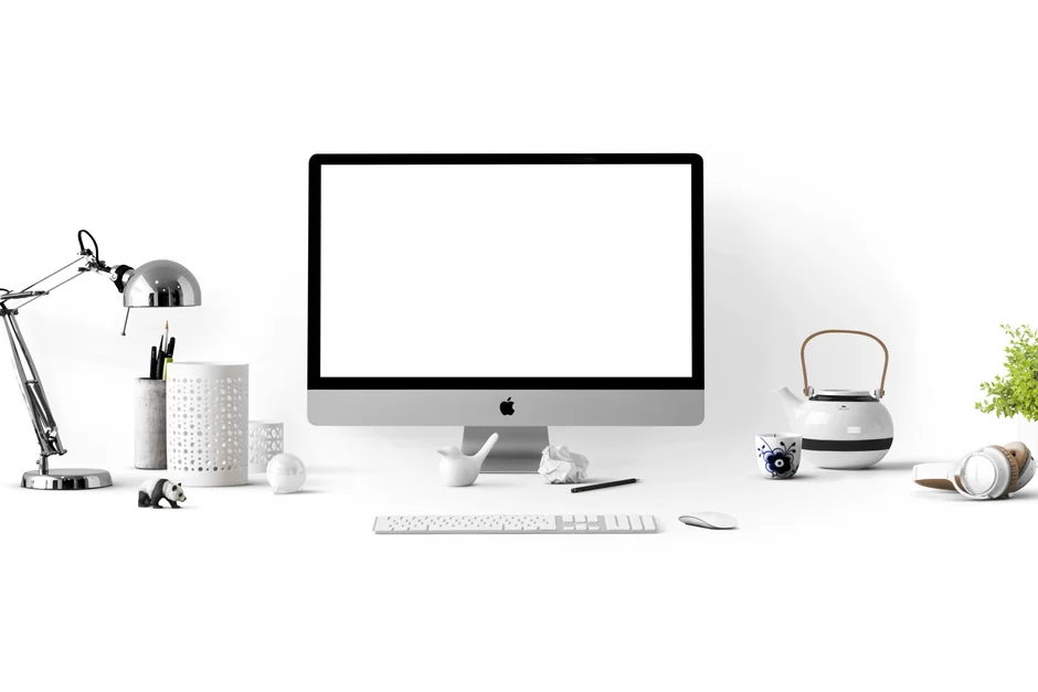 services-01 Dual monitors on a desk, showcasing web design in a modern office setting.